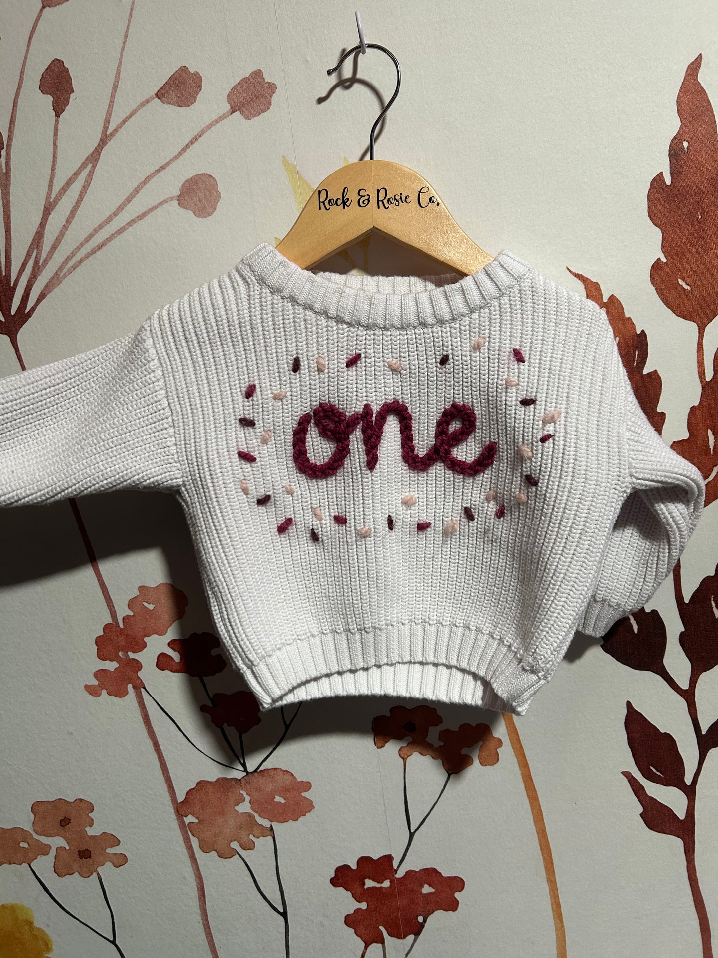 ‘ one ‘ on frost with rose